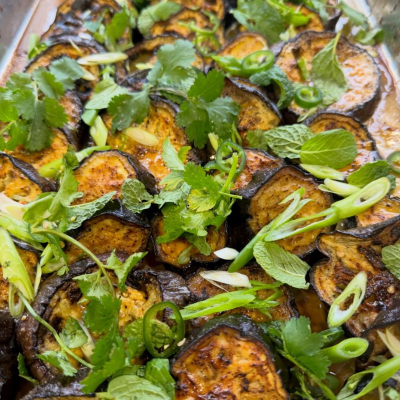 Roast eggplant with chilli, mint, coriander and spring onion