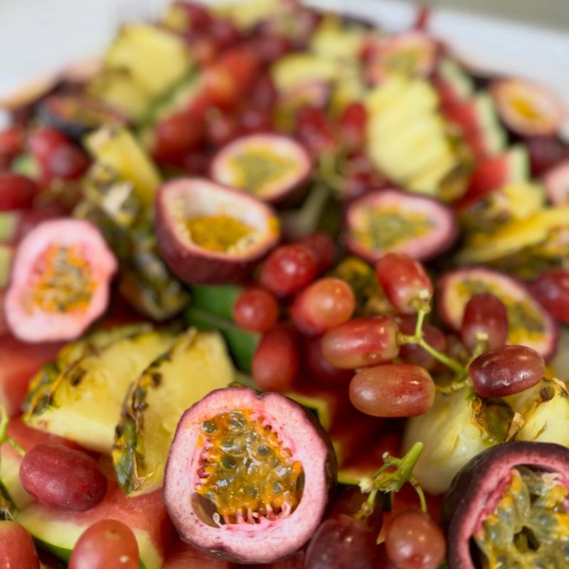 Fresh fruit platter with passionfruit, pineapple, grapes and watermelon